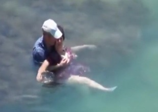 Voyeur captures a couple having sex down the sea